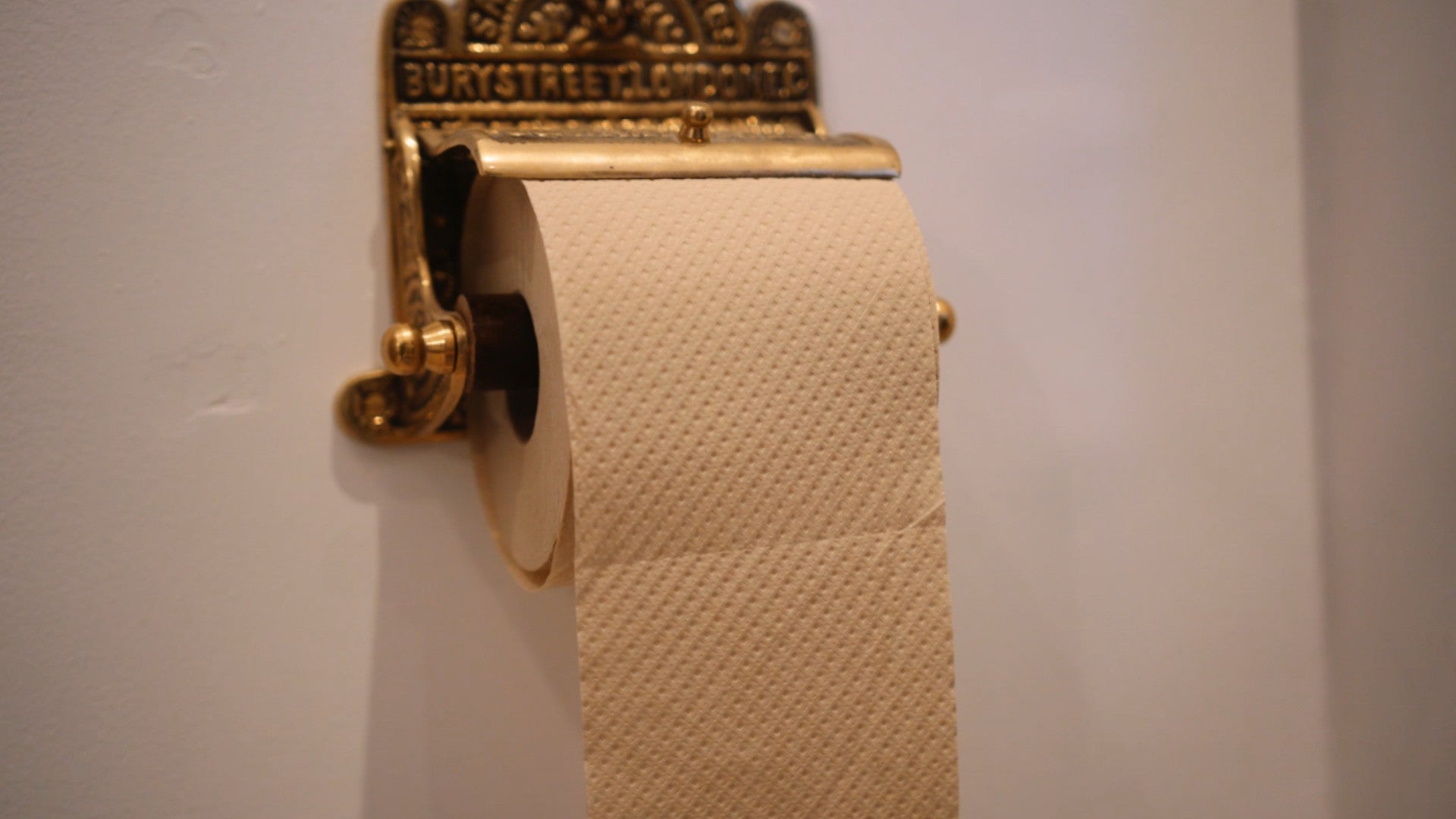Should you hang toilet paper over or under?