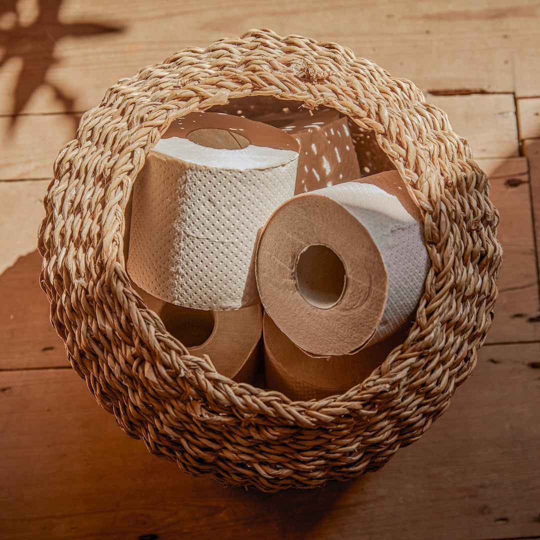 Naked Paper toilet rolls in wicker basket